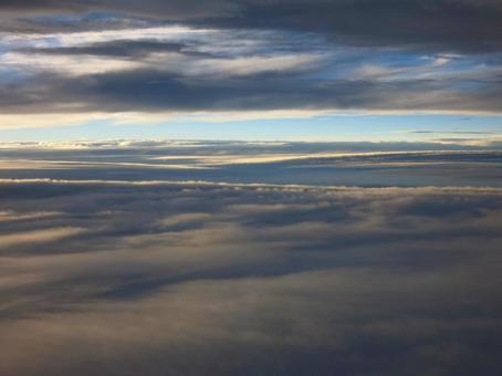 Photo, cloud layer, setting sun, between clouds, 