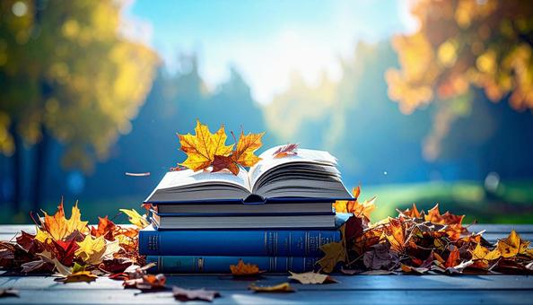 読書の秋 机の上の本 落ち葉の紅葉 読書の秋 机の上の本 落ち葉の紅葉の写真