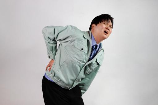 背中の痛みを訴える男性 背中の痛みを訴える男性 背中痛,男性,痛みの写真素材