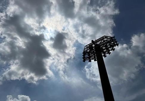 空と野球場の照明 野球,野球場,照明の写真素材