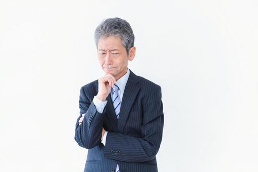 悩む経営者 会社,経営者,高齢者の写真素材