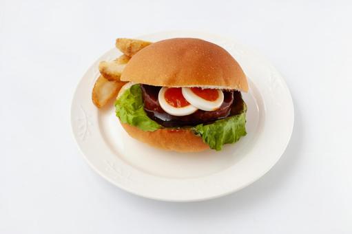 お皿にのせたテリヤキバーガー 白背景 お皿にのせたテリヤキバーガー 白背景の写真