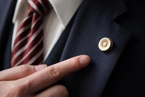 Up of a lawyer pointing at a lawyer badge Up of a lawyer pointing at a lawyer badge