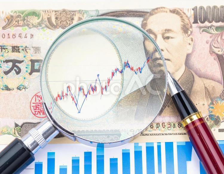 マーケティング　グラフを顕微鏡で見る 顕微鏡,一万円札,赤ペンの写真素材