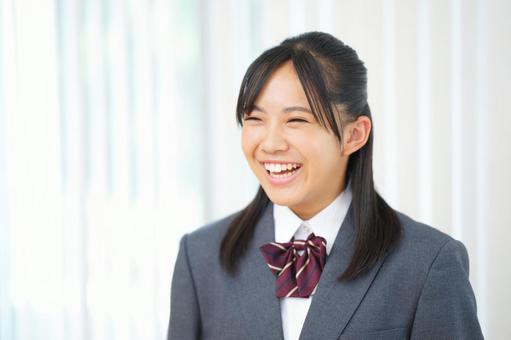 ブレザーの制服を着た笑顔の女の子 ブレザーの制服を着た笑顔の女の子 塾,人物,女の子の写真素材