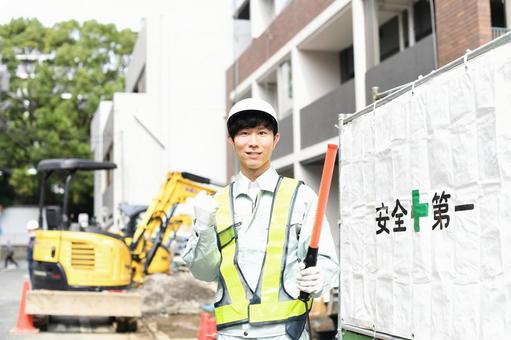 Traffic controller pumping his fist at a construction site, JPG Traffic controller pumping his fist at a construction site, JPG