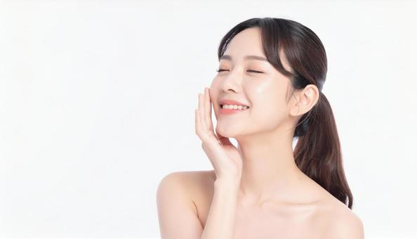 ビューティー 肌を満足げに触る女性 ビューティー 肌を満足げに触る女性の写真