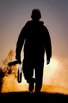 A cameraman moving forward with the setting sun behind him, JPG A cameraman moving forward with the setting sun behind him, JPG