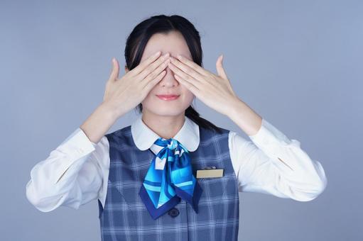 青いリボンの制服の女性が目を手で隠す 女性,目を隠す,ポーズの写真素材