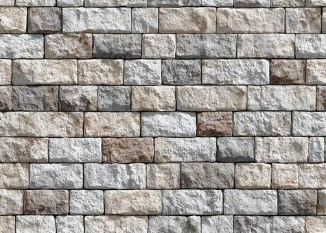 凹凸のある石材の壁のテクスチャの写真