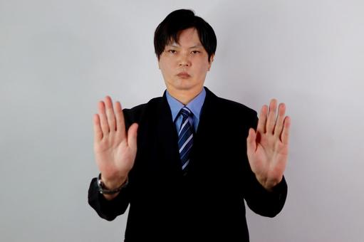 手で止めるビジネスマン ビジネス,男性,スーツの写真素材