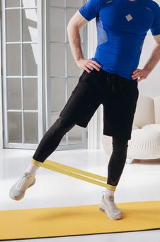 Photo, from the neck down, muscle training, stand on one foot, 