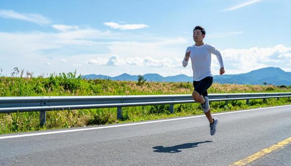 全速力で走る日本人男性 全速力で走る日本人男性の写真