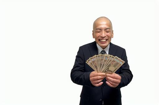 ボーナスを貰って笑顔のスーツ中年男性 男性,ビジネス,スーツの写真素材