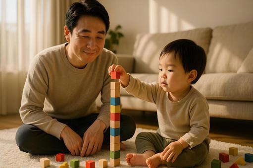 積み木で遊ぶ父と子 積み木で遊ぶ父と子の写真