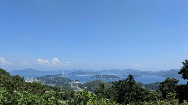 丘の上から見下ろす海の道 丘の上から見下ろす海の道 しまなみ海道,晴天,イメージの写真素材