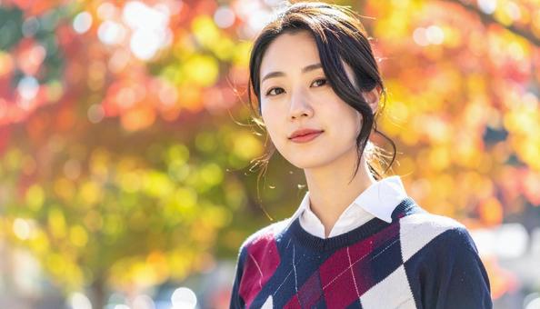 アーガイル柄のセーターを着た日本人女性 アーガイル柄のセーターを着た日本人女性 の写真