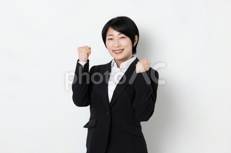両手でガッツポーズしているビジネスウーマン 女,女子,ビジネスウーマンの写真素材
