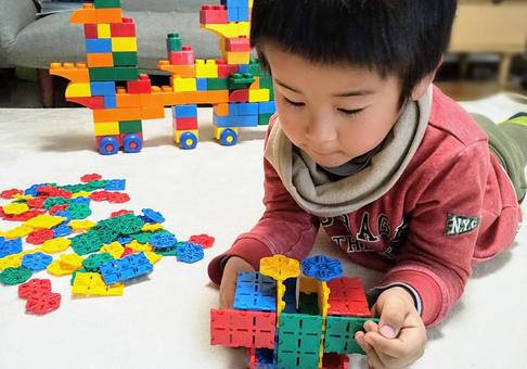 Boy lying down and playing with blocks, block, children, a nursery school, JPG