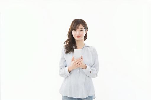 若い女性 スマートフォン 若い女性 スマートフォンの写真