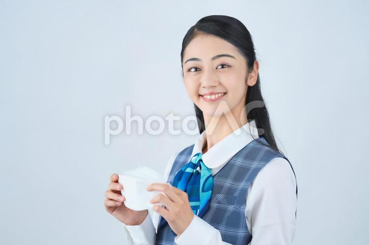 マスクを持っているビジネスウーマン 女性,ビジネスウーマン,会社員の写真素材