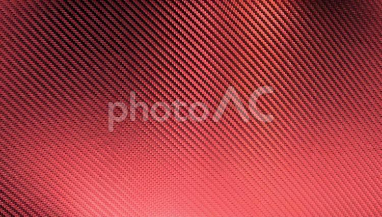 光沢の有る赤色のカーボンファイバーの背景画像 背景,赤,レッドの写真素材