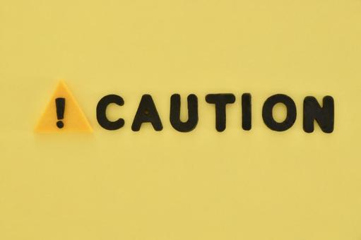 警告マークとcautionの文字 caution,警告マーク,警告の写真素材