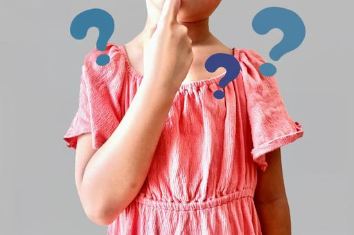 A child thinks with his hand on his chin, JPG A child thinks with his hand on his chin, JPG