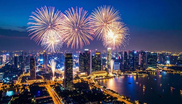 高層ビルの上で打ち上げられる大輪の花火 高層ビルの上で打ち上げられる大輪の花火の写真