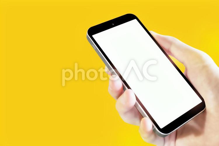 左向きスマートフォン 画面空欄 イエロー 5750 スマートフォン,スマートホン,スマホの写真素材