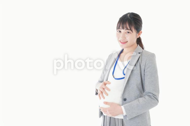 妊娠中の若いビジネスウーマン 体調管理,手当て,福利厚生の写真素材