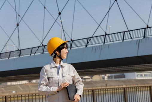 Woman in work clothes at a construction site, JPG