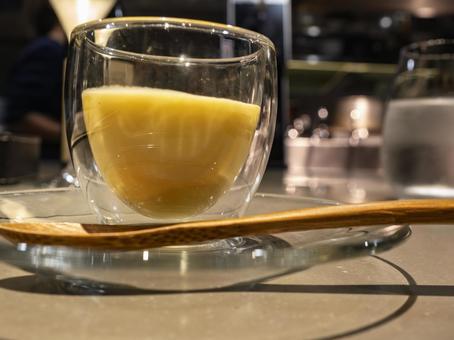 Photo, corn potage, double wall glass, wooden spoon, 