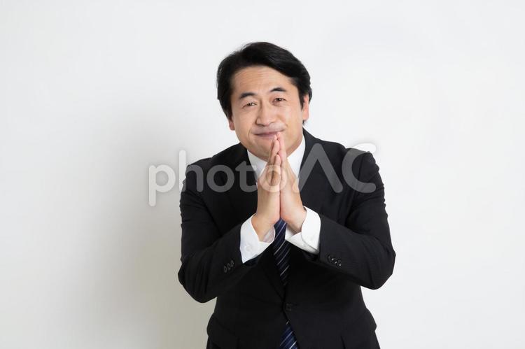 無茶な頼み事をしている中年のサラリーマン男性 中年,上司,会社員の写真素材