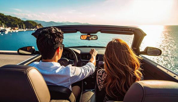 オープンカーに乗ってデートするカップル オープンカーに乗ってデートするカップルの写真