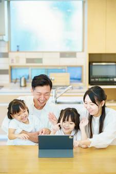 Parent and child looking at the screen of the tablet PC Parent and child looking at the screen of the tablet PC
