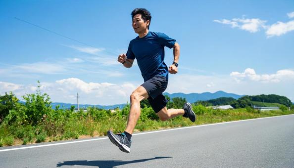 全速力で走る日本人男性 全速力で走る日本人男性の写真