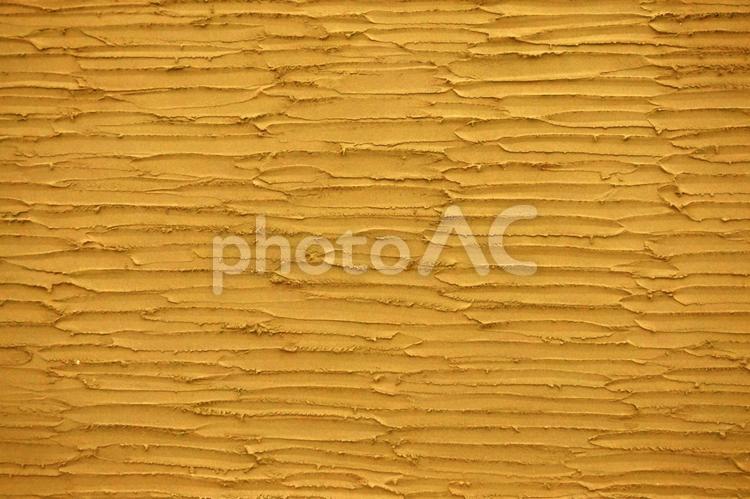 横縞模様のコテ跡のコンクリート壁オレンジ オレンジ,黄色,黄土色の写真素材