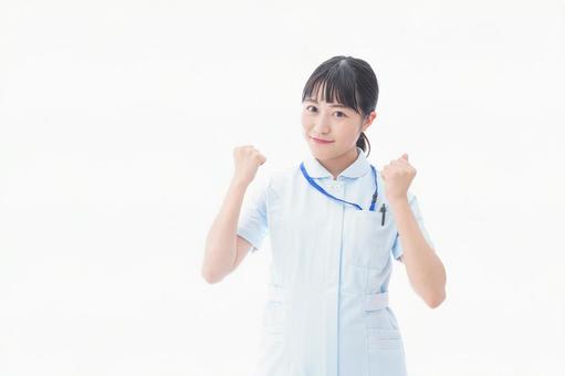 ナース服を着た若い笑顔の看護師 ナース服を着た若い笑顔の看護師 学生,笑顔,女性の写真素材