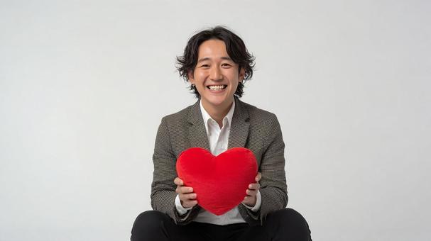 満面の笑みで愛を表現する男性 満面の笑みで愛を表現する男性の写真