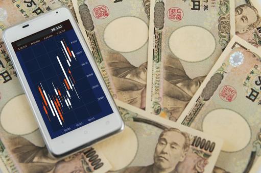 スマホと日本円の投資チャート スマホと日本円の投資チャートの写真