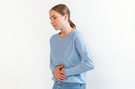 生理痛でお腹を押さえる女性（白背景） 生理,月経,女性の写真素材
