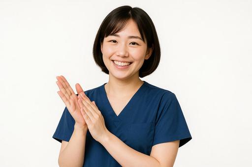 喜んで拍手する看護師 喜んで拍手する看護師の写真