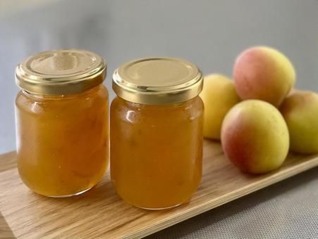 Homemade ripe plum jam on a wooden tray, JPG