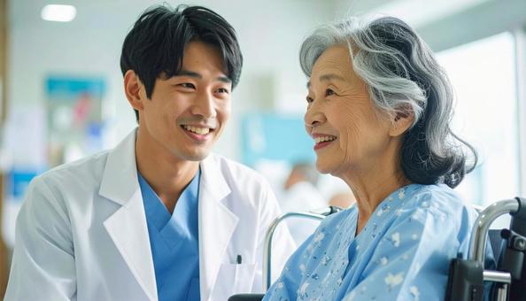 高齢の患者に優しく語り掛ける男性医師 高齢の患者に優しく語り掛ける男性医師の写真