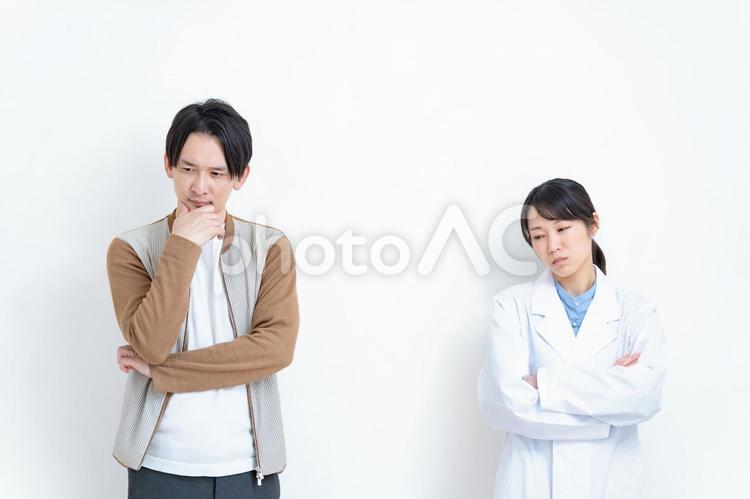 悩む男性と医師 仕事,医師,女性の写真素材