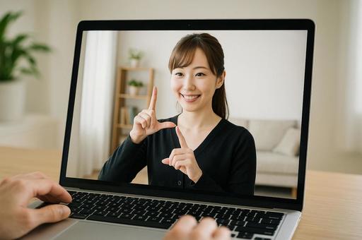 オンライン会議で画面越しに手話通訳 オンライン会議で画面越しに手話通訳の写真