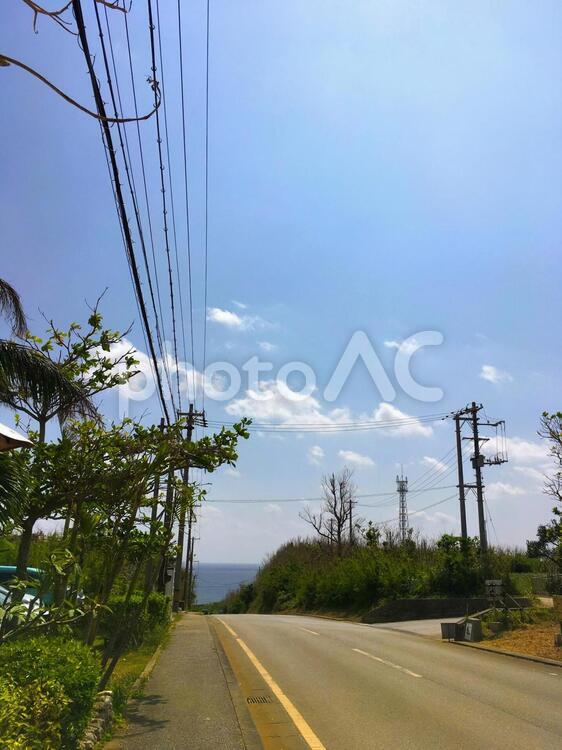 宮古島の風景03 青空,道,雲の写真素材