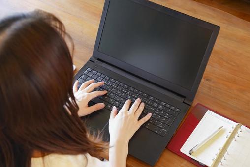 Hands of a woman working on a laptop, JPG