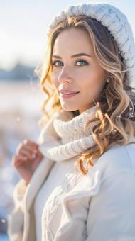 冬の寒冷な雪原の中の可愛い女性の写真